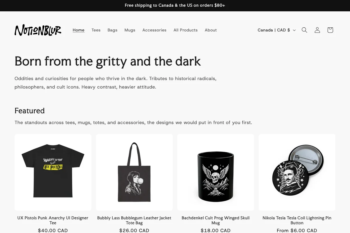 Notionblur homepage on a white background. Wordmark in heavy black brush type, navigation reading Home, Tees, Bags, Mugs, Accessories, All Products, About, headline 'Born from the gritty and the dark', and a Featured row of four products, a UX Pistols anarchy tee, a Bubbly Lass tote bag, a Bachdenkel skull mug, and a Nikola Tesla pin button