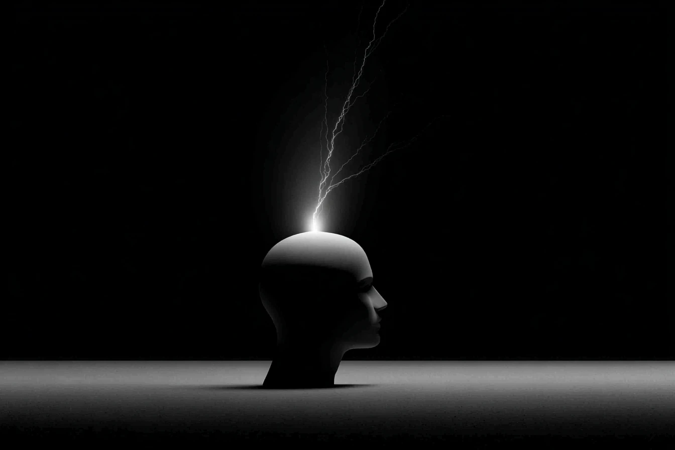 A featureless mannequin head in profile with a bolt of lightning striking upward from its crown against black.