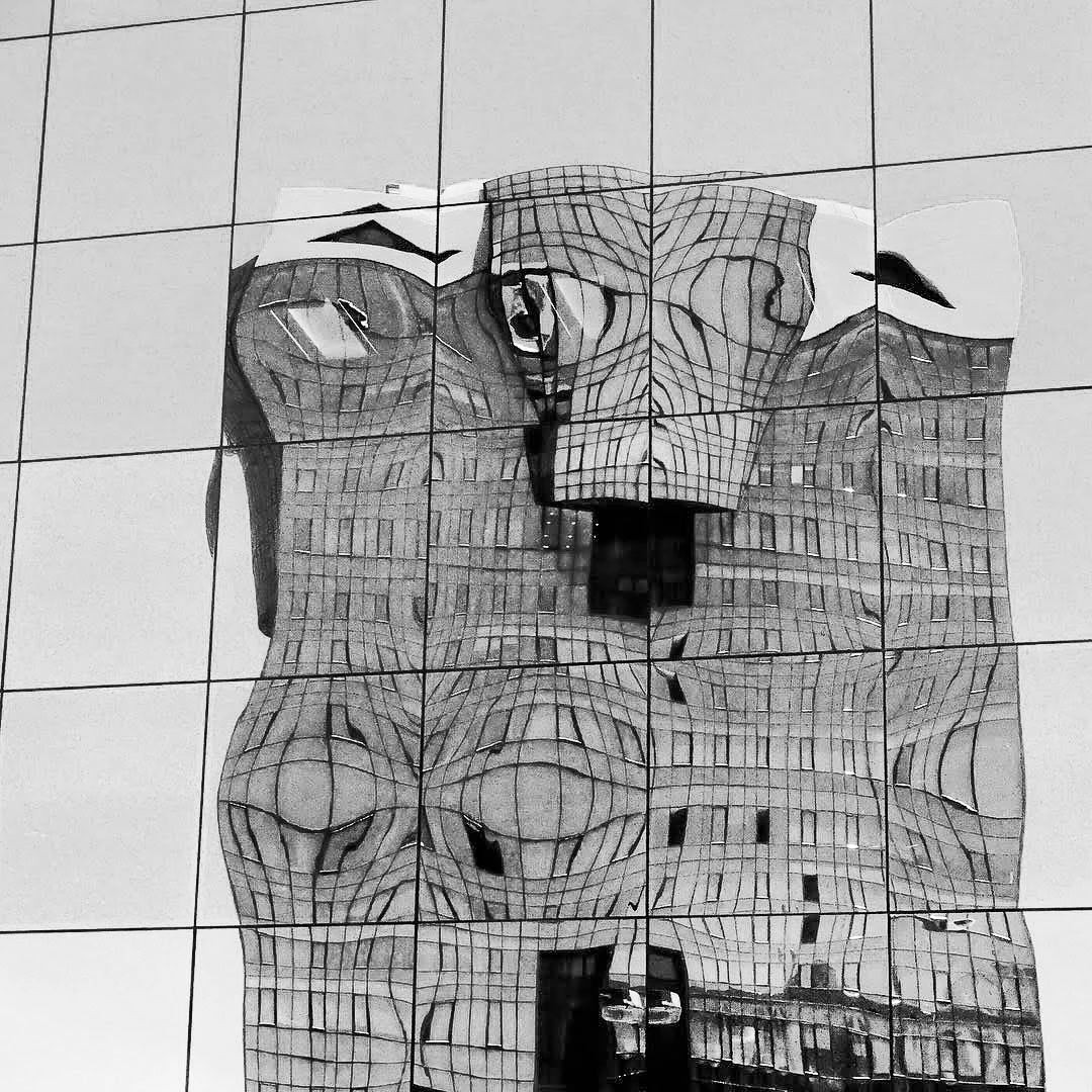 Black and white abstract reflection of a building distorted across mirrored glass panels of a skyscraper facade